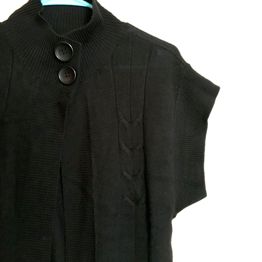 Never worn, women’s cardigan sweater.